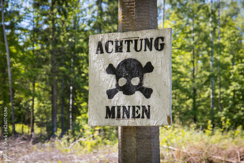 Warning of mines. Danger of explosion. Line of defense. Military base. German inscription: 