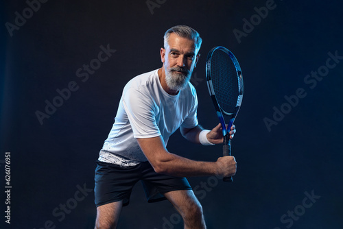 Old man. Tennis player banner on the black background. Tennis template for ads with copy space. Mockup for betting advertisement. Sports betting on tenis © Mike Orlov