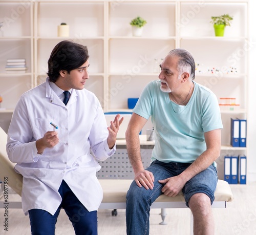 Old man visiting young male doctor © Elnur