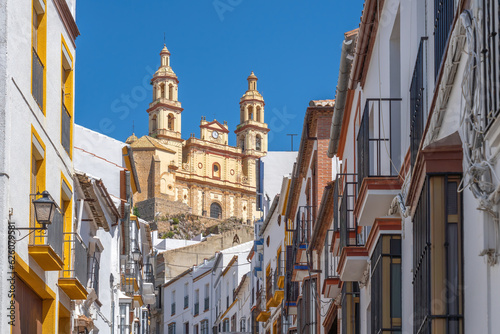 Street with Church of Nuestra Senora de la Encarnacion - Olvera, Andalusia, Spain