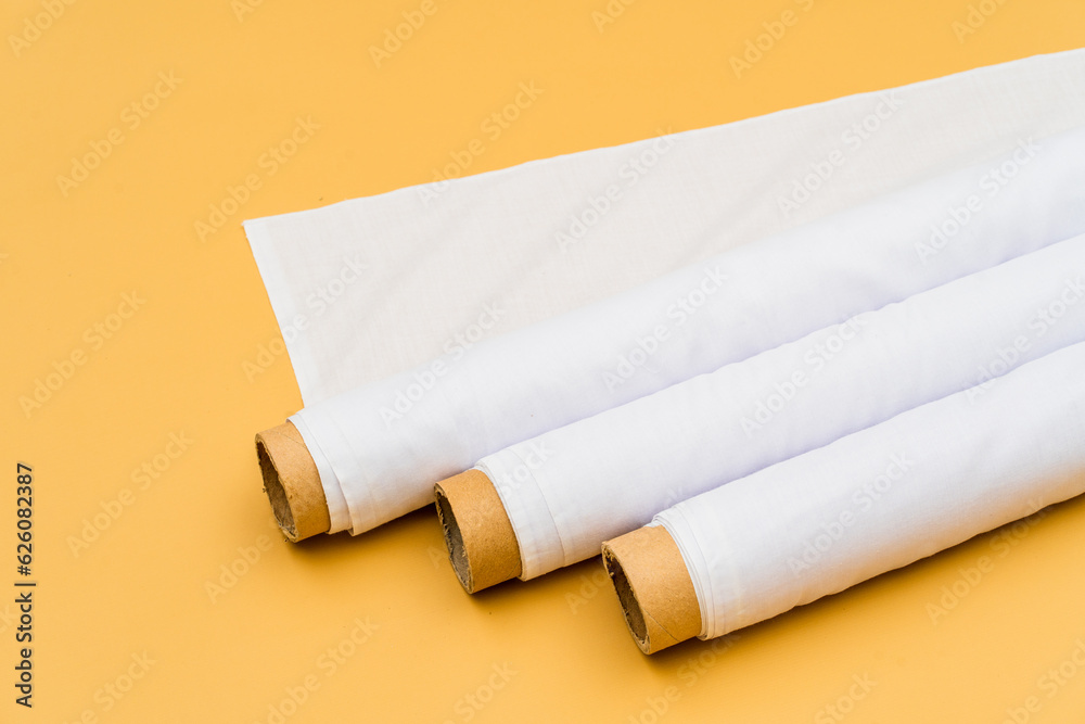 Fototapeta premium Envisioned in a minimalistic environment, the mockup of a white fabric roll image creates a visually striking presentation