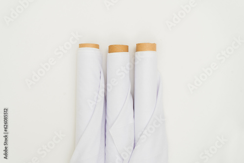 In a carefully curated minimalistic presentation, the mockup of the white fabric roll image exudes sophistication