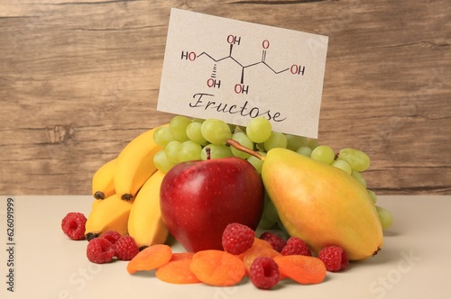 Fotografía Card with word Fructose, delicious ripe fruits, raspberries and dried apricots o