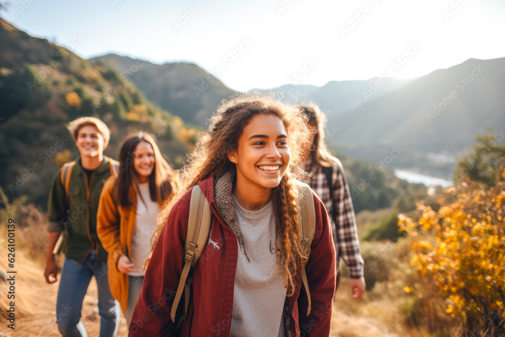 A group of teenagers hiking and enjoying nature, a group of young friends exploring the great outdoors, embracing an active lifestyle in nature - obrazy, fototapety, plakaty 