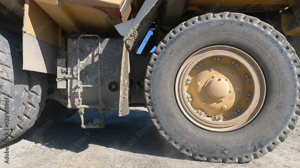 Large quarry dump truck transporting ore, slow motion Large quarry dump truck transporting ore, slow motion