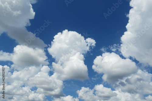 Blue sky with beautiful fluffy clouds, natural background © natalya2015