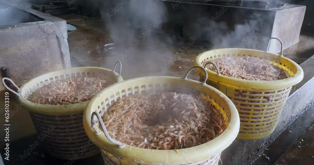 close up of big plastic baskets filled with cooked shrimps inside the factory close up of big plastic baskets filled with cooked shrimps inside the factory