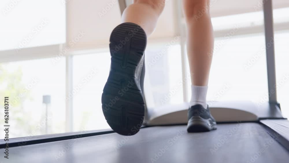 Fitness female walking on treadmill. Asian woman workout cardio and training at gym Fitness female walking on treadmill. Asian woman workout cardio and training at gym