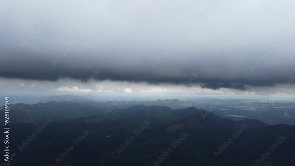 Aerial view ascending toward dark raining cloud Aerial view ascending toward dark raining cloud