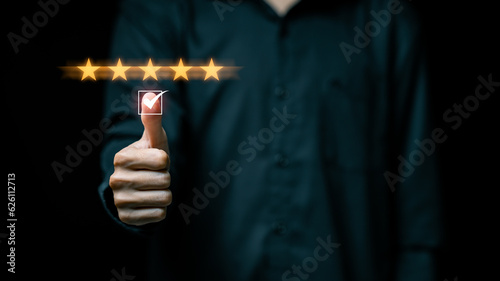 Customer satisfaction concept, thumbs up icon right with awesome And give a five-star rating, showing satisfaction with the excellent service. Feedback from client. photo