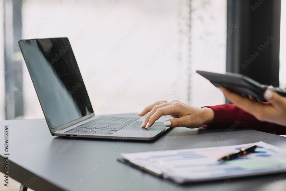 Entrepreneur Asian businessman and businesswoman discussing new business project in tablet in modern Meeting In Modern Office, Asian business casual concept. Entrepreneur Asian businessman and businesswoman discussing new business project in tablet in modern Meeting In Modern Office, Asian business casual concept.