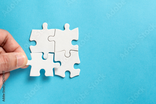 Four pieces of plain white jigsaw puzzle for business concept