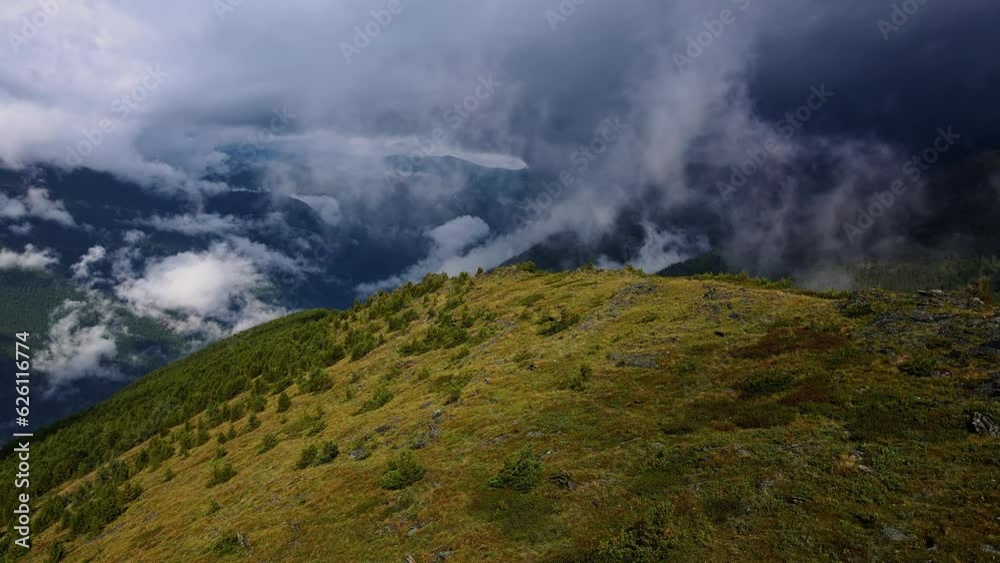 A mesmerizing view of the green mountains and cloud-filled valley
