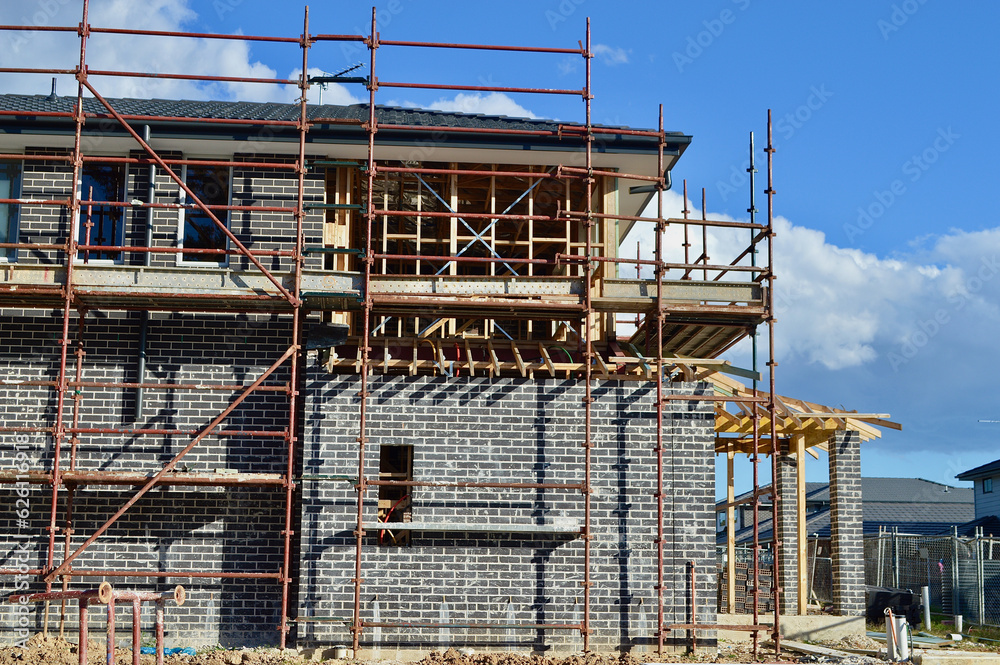 scaffolding on a construction site in the suburbs scaffolding on a construction site in the suburbs