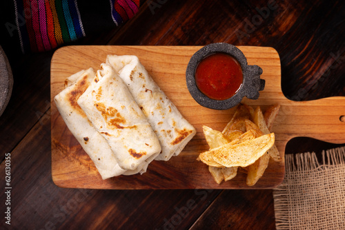 Burritos. Wrapped wheat flour tortilla, can be filled with various ingredients such as scrambled eggs or minced meat, beans and vegetables, a very popular dish in Mexico and the southern USA.