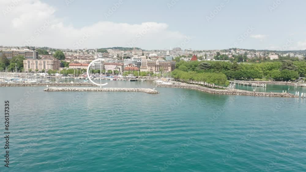 Drone flying away from beautiful yacht harbor in Lausanne, Switzerland Drone flying away from beautiful yacht harbor in Lausanne, Switzerland