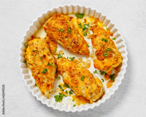 baked chicken breasts under cracker cheese crust