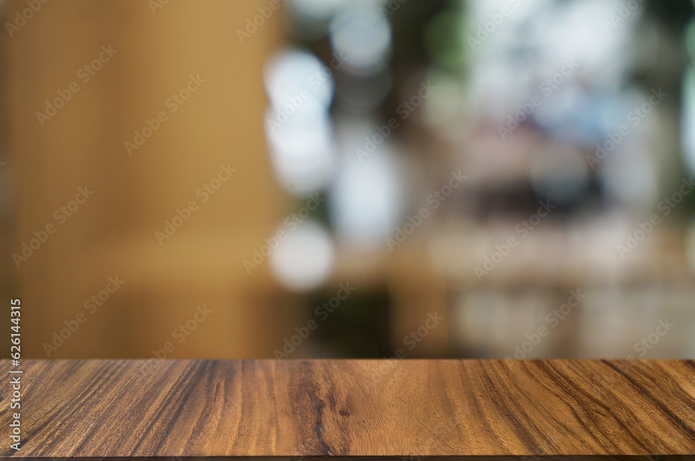 Empty dark wooden table in front of abstract blurred boken bankground of restaurant. Can used for display or montage your products. Mock up for space. Empty dark wooden table in front of abstract blurred boken bankground of restaurant. Can used for display or montage your products. Mock up for space.
