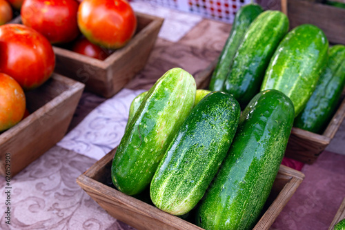 Cucumbers and tomatoes at farmers market