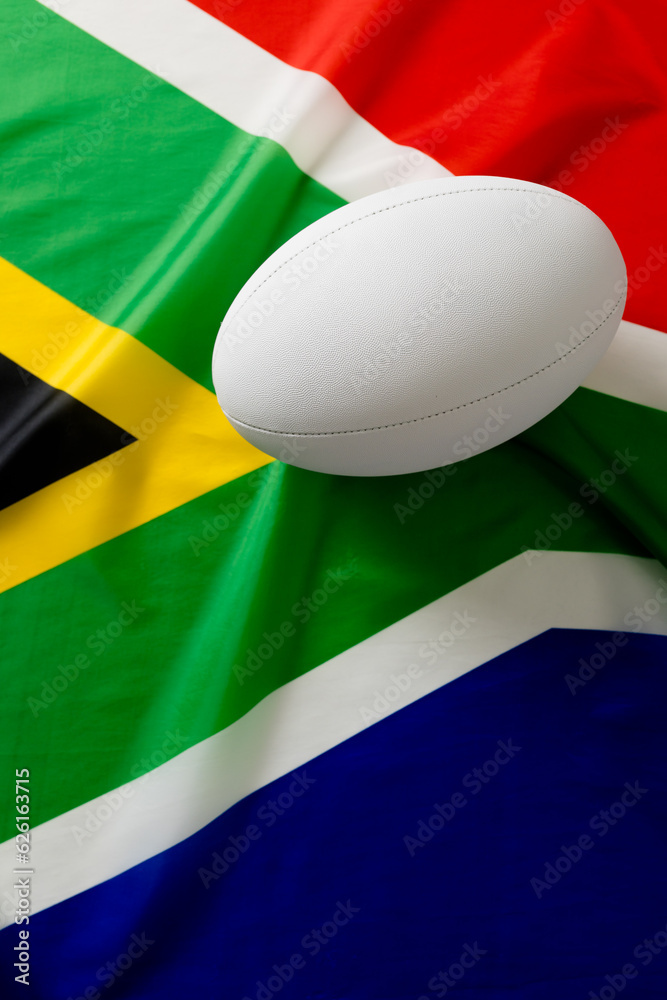 Obraz premium White rugby ball over flag of south africa
