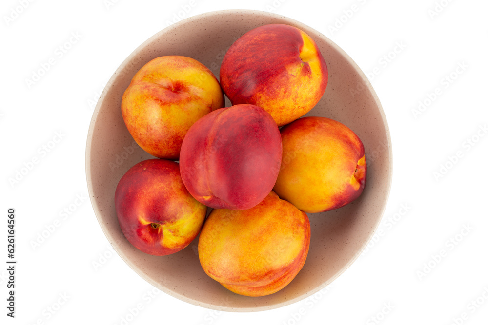 Fresh nectarines fruits in bowl isolated on white background. Ripe peach top view. Fresh nectarines fruits in bowl isolated on white background. Ripe peach top view.