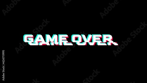 Looping GAME OVER text animation with glitch effect isolated on black screen background. Glitch GAME OVER motion graphics text on video game screen. Cyberpunk effect with RGB distortion