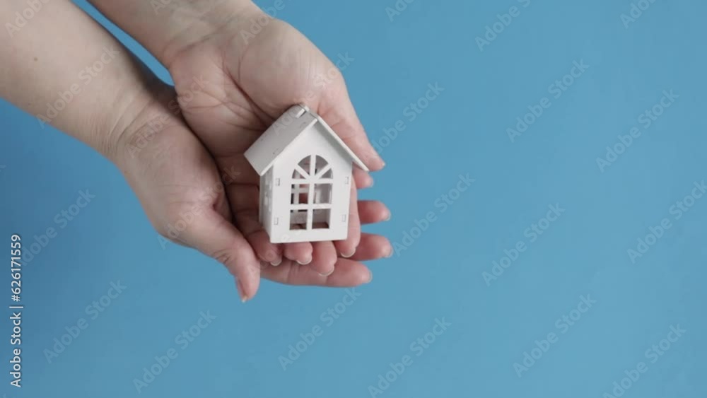 real estate purchase sale and rent banner, property insurance, hands holding a house, blue background real estate purchase sale and rent banner, property insurance, hands holding a house, blue background