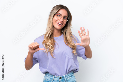 Young Uruguayan woman isolated on white background counting six with fingers