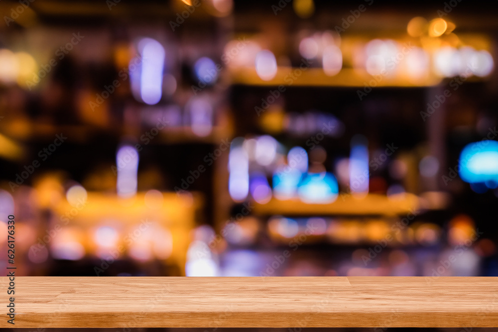 Wooden table with blurred bar background