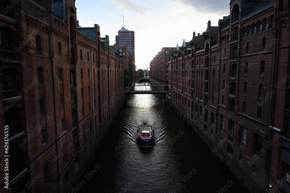 Boat on the Kehrwiederfleet Canal in the Speicherstadt Warehouse District of Hamburg