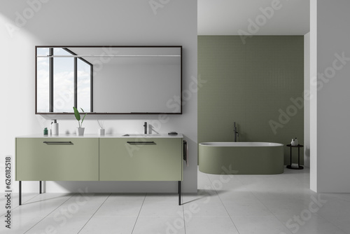 Modern hotel bathroom interior with double sink and bathtub  accessories