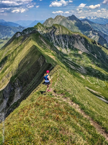 Trail running on the Hardergrat. Hiking on the harder ridge. Breathtaking view above Lake Brienz. Brienzer Rothorn. High quality photo