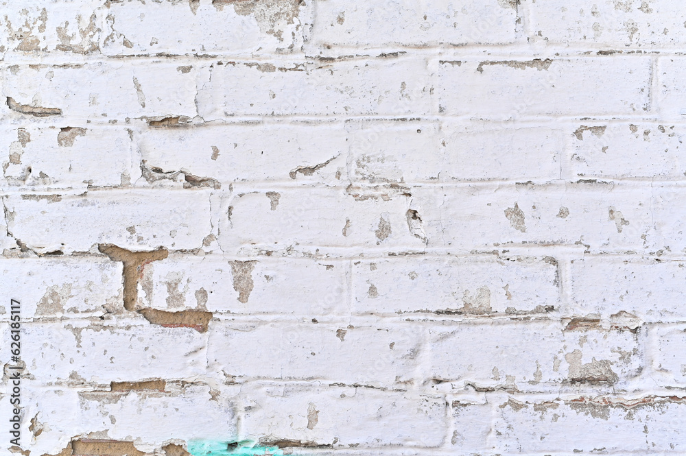 white wall background. Old grungy brick wall of horizontal texture. Brick wall background. Stone wallpaper. Grunge wall. Brick wall with white uneven plasters