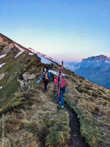 Ski tour on the Gemsfairenstock in spring. First to the snow hiking. Ski mountaineering in Glarus Uri Switzerland. High quality photo