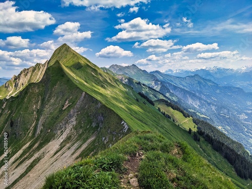 Hiking on the breathtaking Hardergrat in the Bernese Alps. Extremely dangerous path on the mountain ridge. High quality photo photo