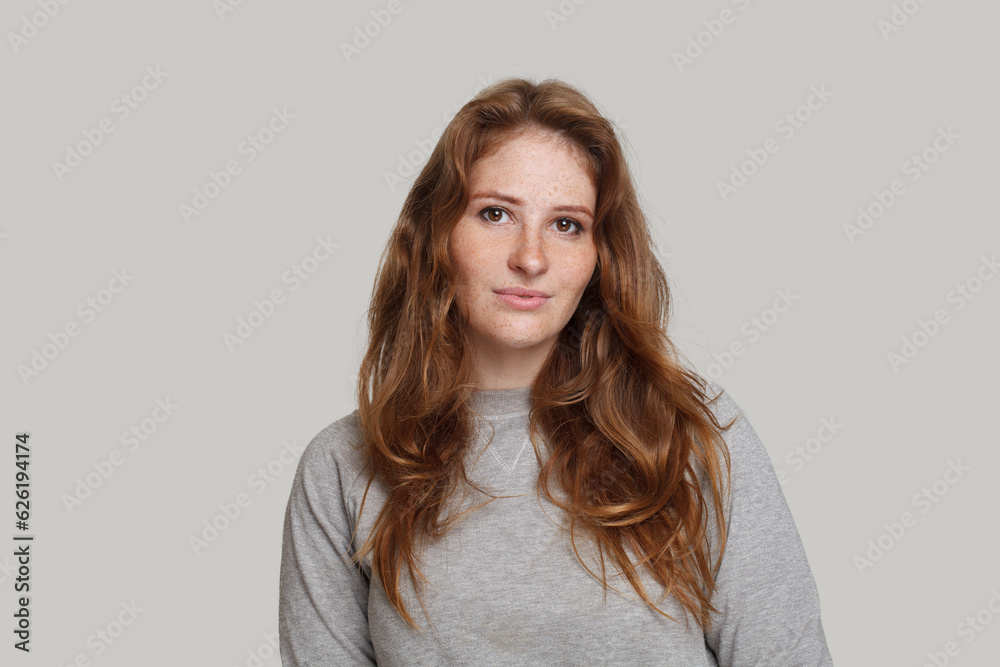 Redhead female model on white background, studio portrait Redhead female model on white background, studio portrait