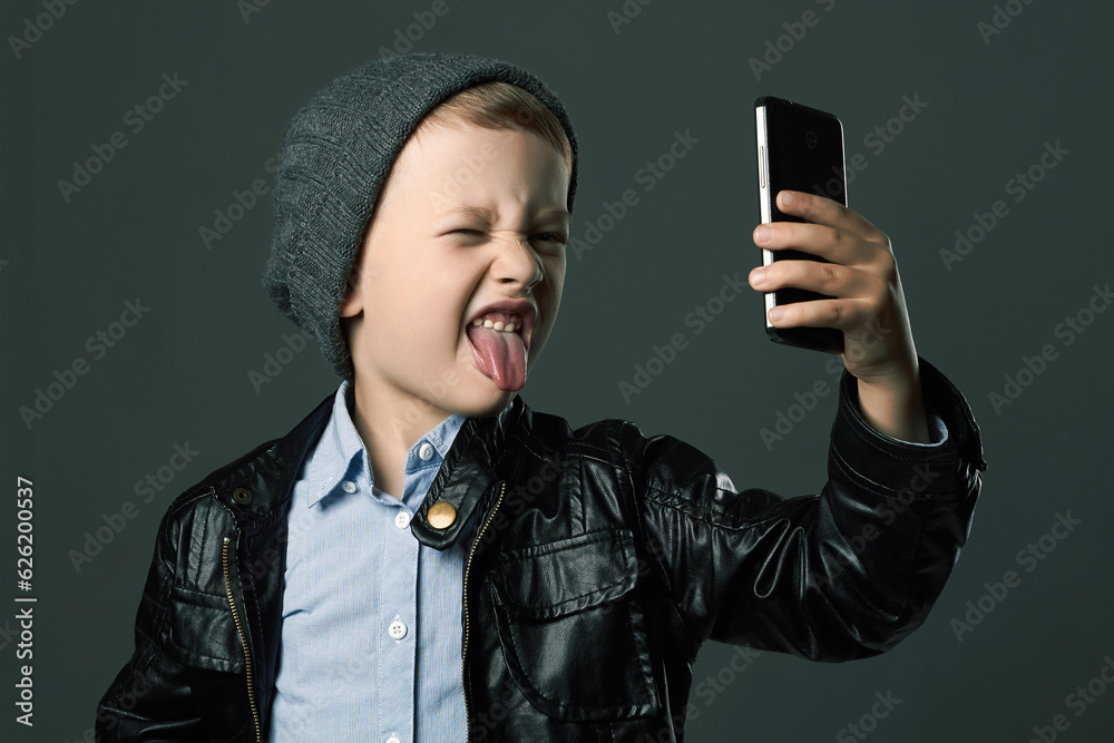Child in Hat and Leather jacket doing selfie Child in Hat and Leather jacket doing selfie