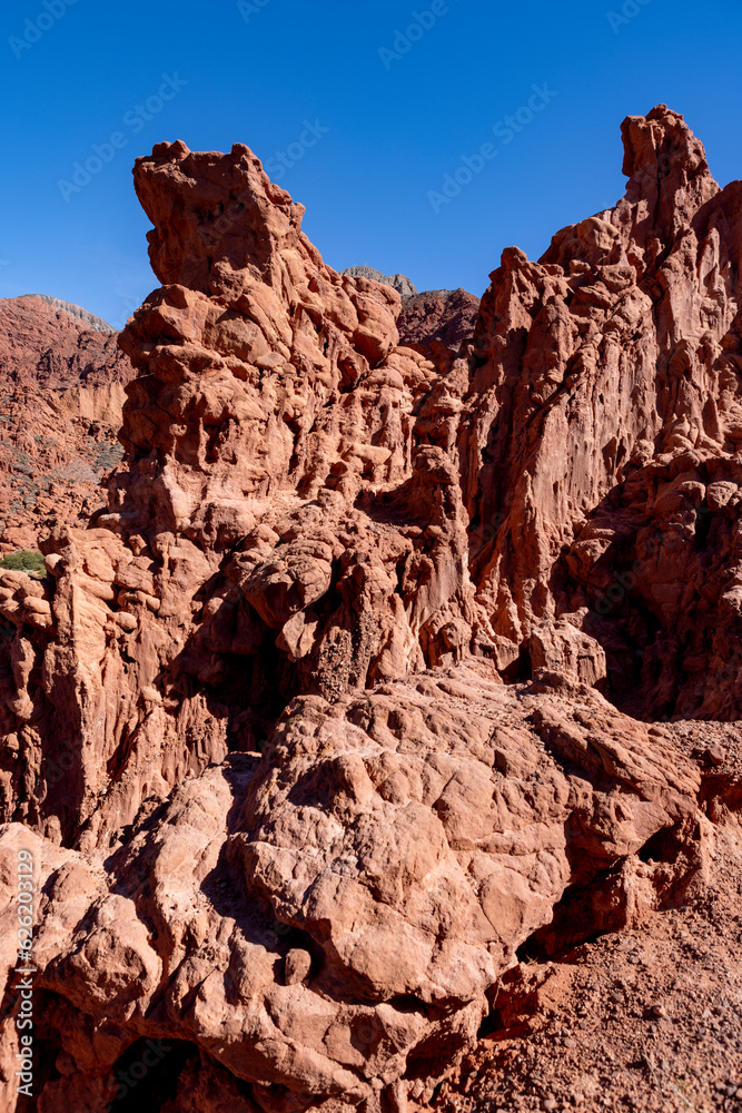 Hiking through the red canyons of the Quebrada de las Señoritas in Jujuy, Argentina - Traveling and exploring the beautiful sights of South America