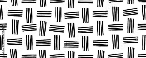 Linocut seamless pattern with vertical and horizontal short stripes. Vector fabric texture. Abstract grunge weave texture. Geometric pattern with simple doodle shapes. Abstract ethnic banner.