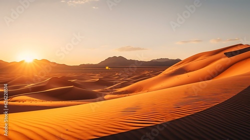 a sandy desert with the sun setting