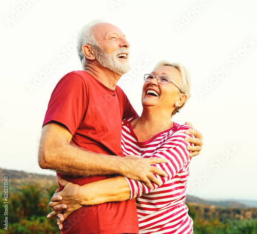 woman man outdoor senior couple happy lifestyle retirement together smiling love hug nature mature