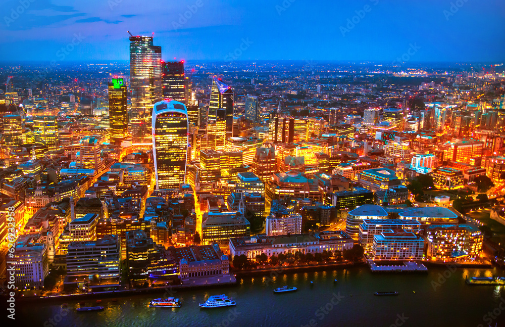 City of London business and banking area at nigh with beautiful lit up skyscrapers and streets.  UK