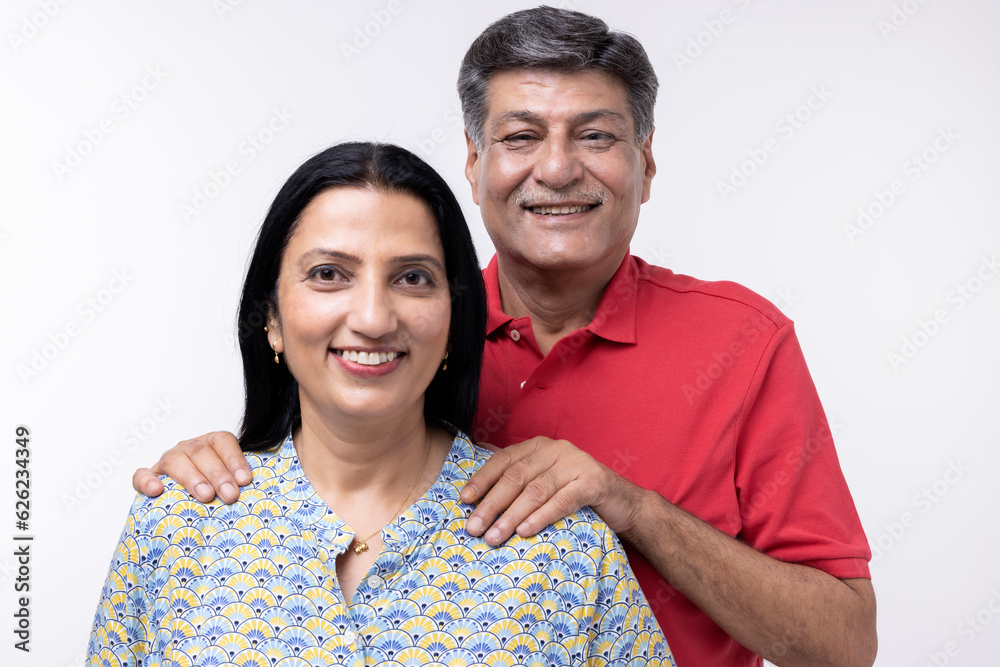 Portrait of loving senior couple over white background Portrait of loving senior couple over white background