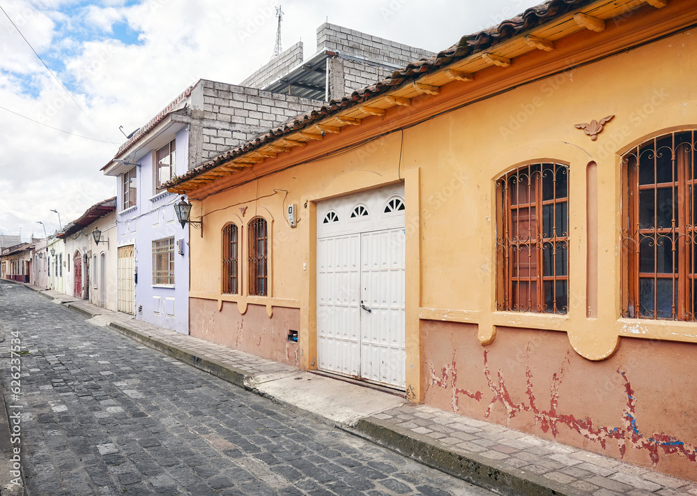 Street of Latacunga town paved with cobblestone, Ecuador.