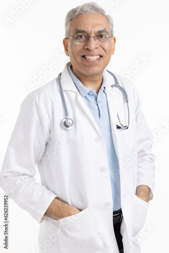 Senior male doctor looking at camera