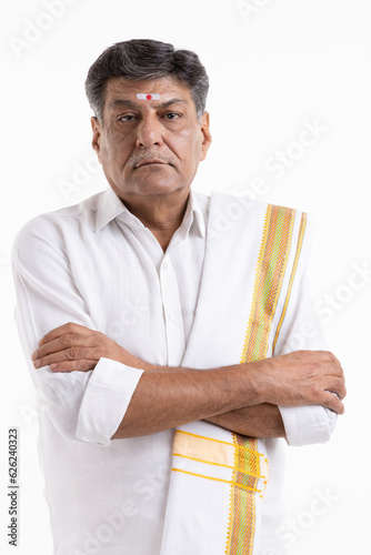 Photography South Indian Senior man posing in traditional wear