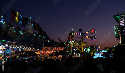 funfair at night with purple sky