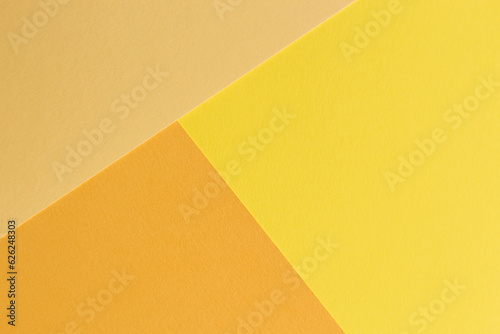 The paper yellow and orange colors is lying on the table