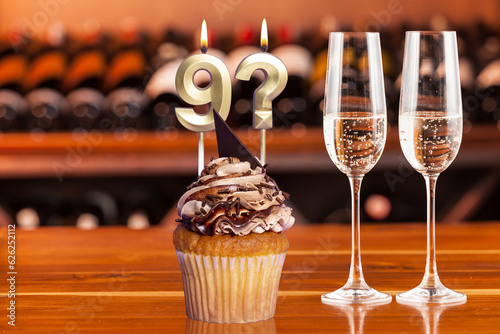 Fototapeta Naklejka Na Ścianę i Meble -  Cupcake With Numbers And Glasses With Wine For Birthday Or Anniversary