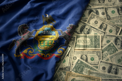 colorful waving national flag of pennsylvania state on a american dollar money background. finance concept